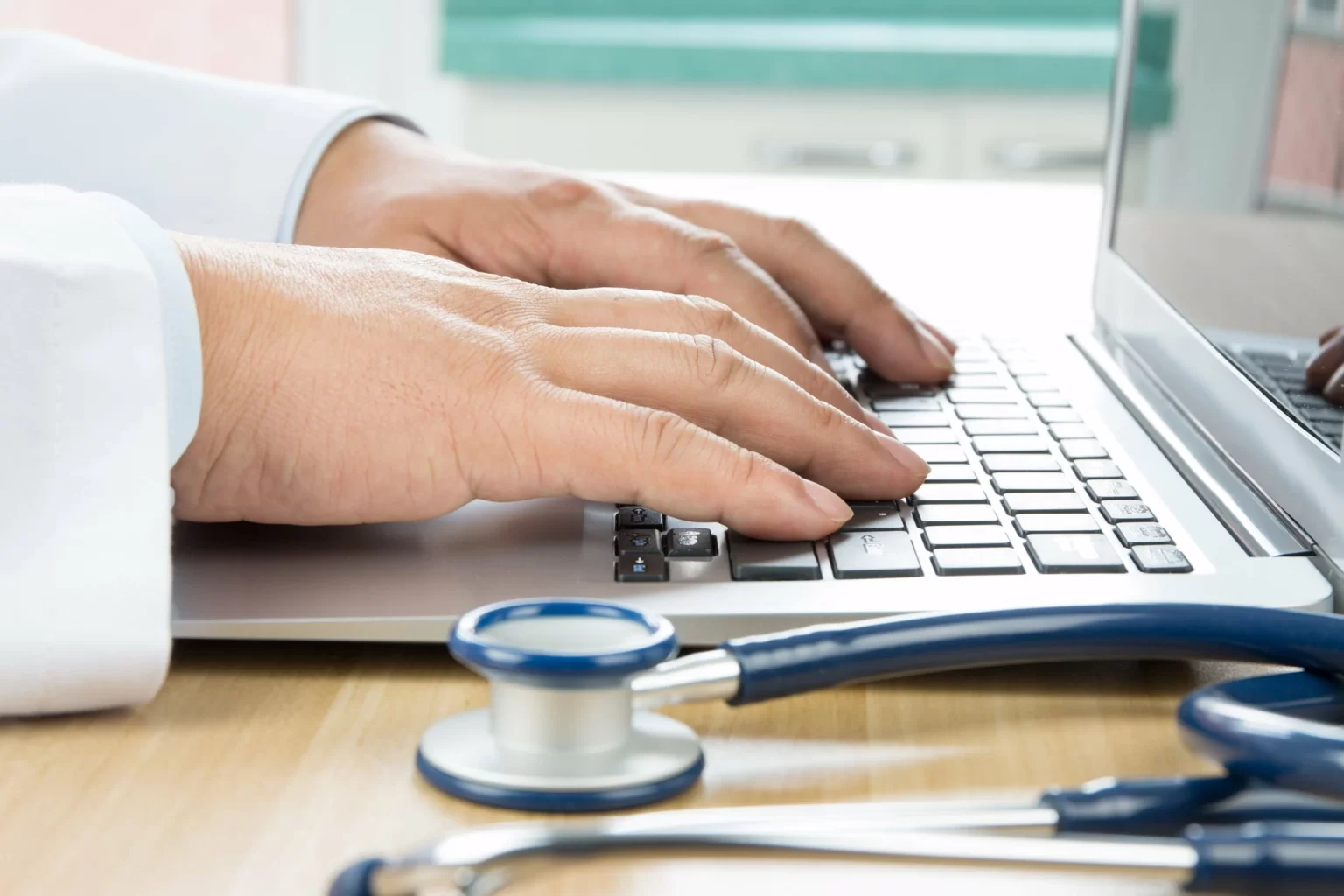 Doctor using laptop